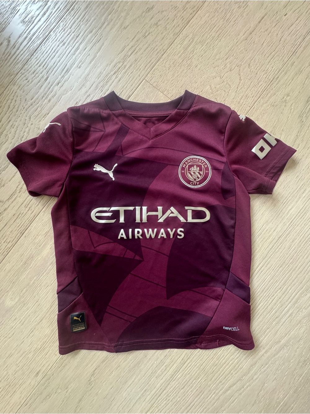 Puma Kids Burgundy Manchester City Jersey with Etihad Logo